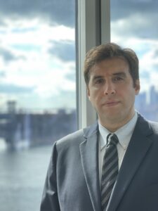 Portrait Image of Brooklyn Lawyer Brian Berger with Williamsburg Bridge in background.
