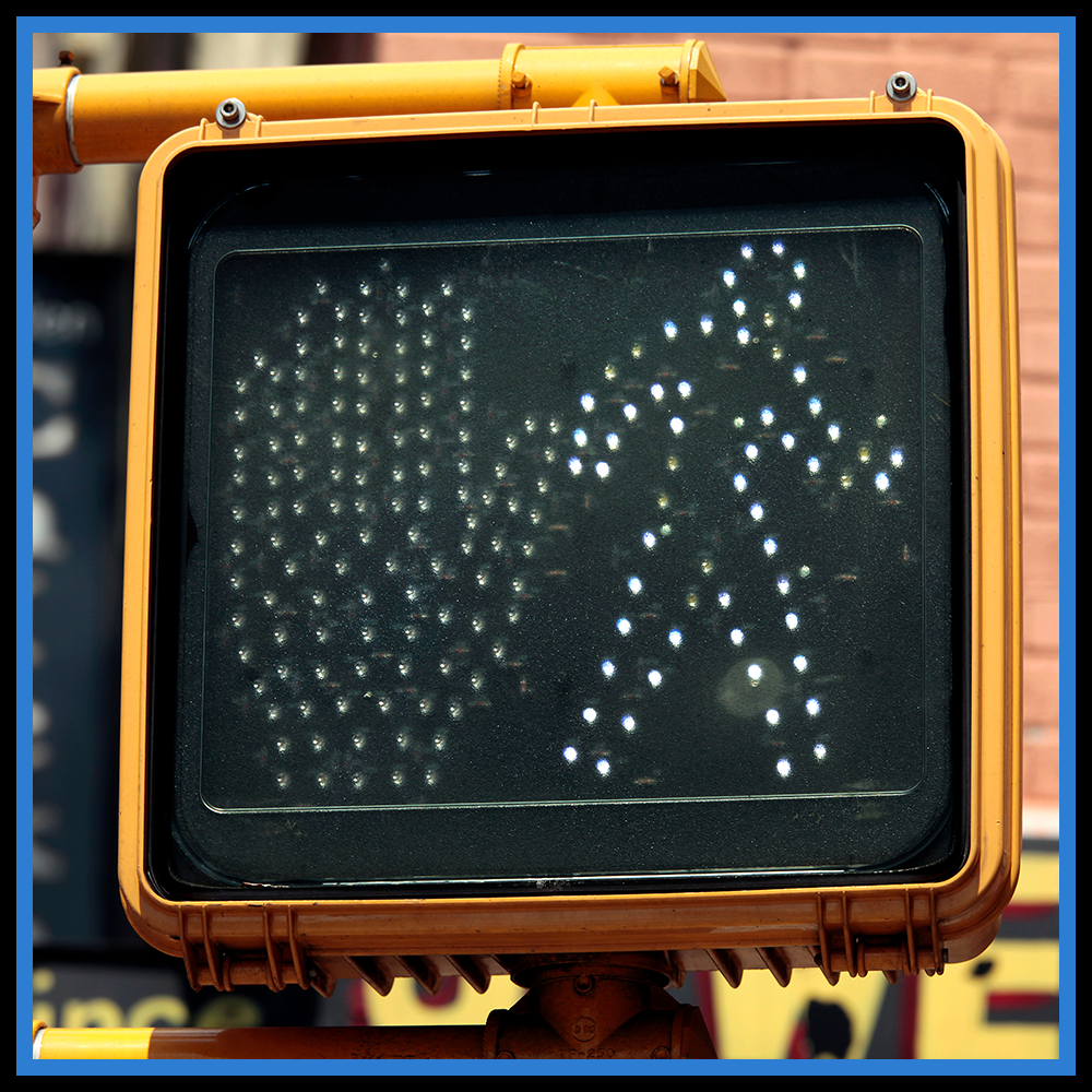 Picture showing a pedestrian walk signal.